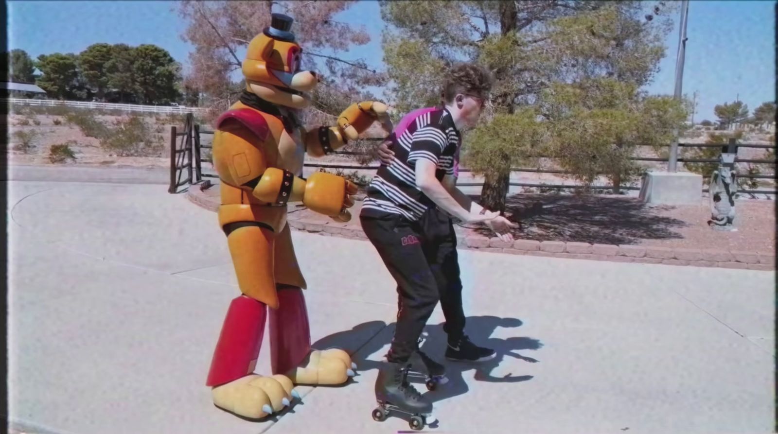 a man riding a skateboard next to a cartoon character