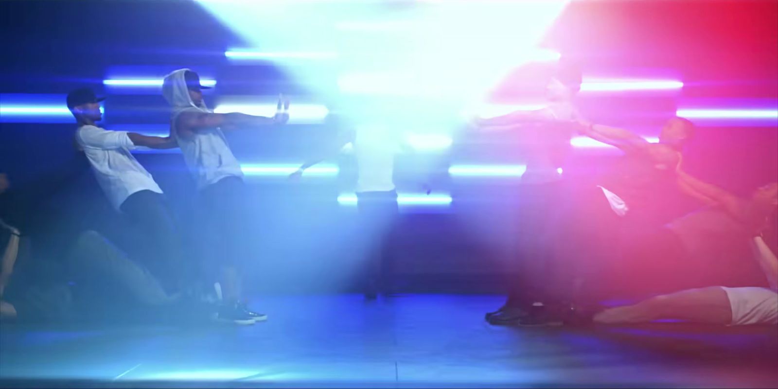 a group of people standing on top of a stage