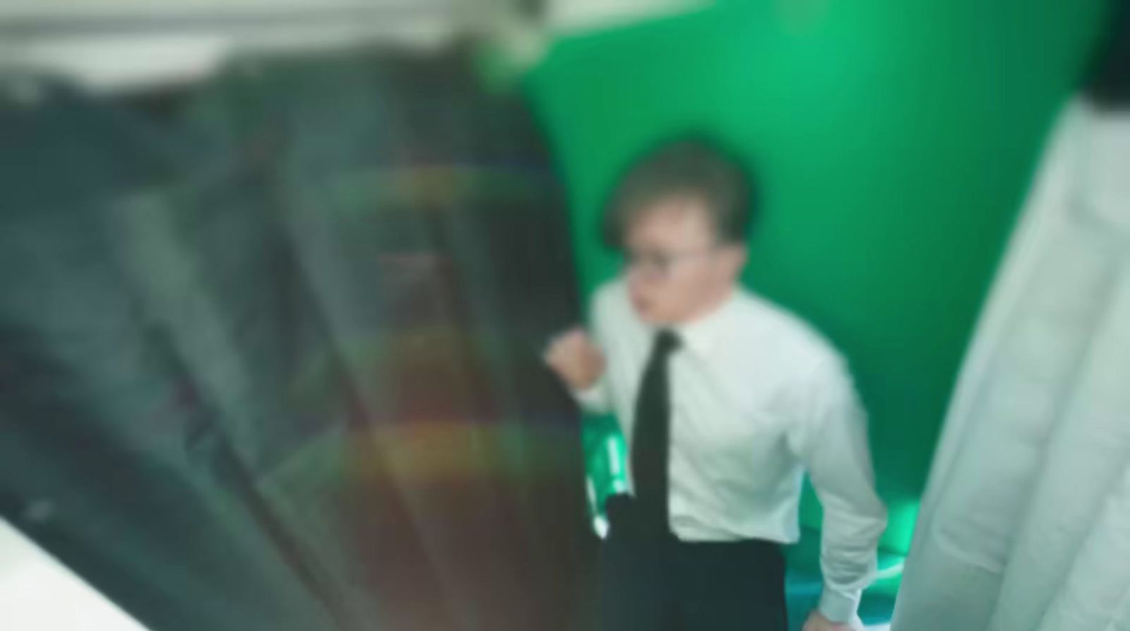 a blurry photo of a man in a tie