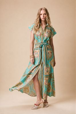 a woman in a dress with a high slit