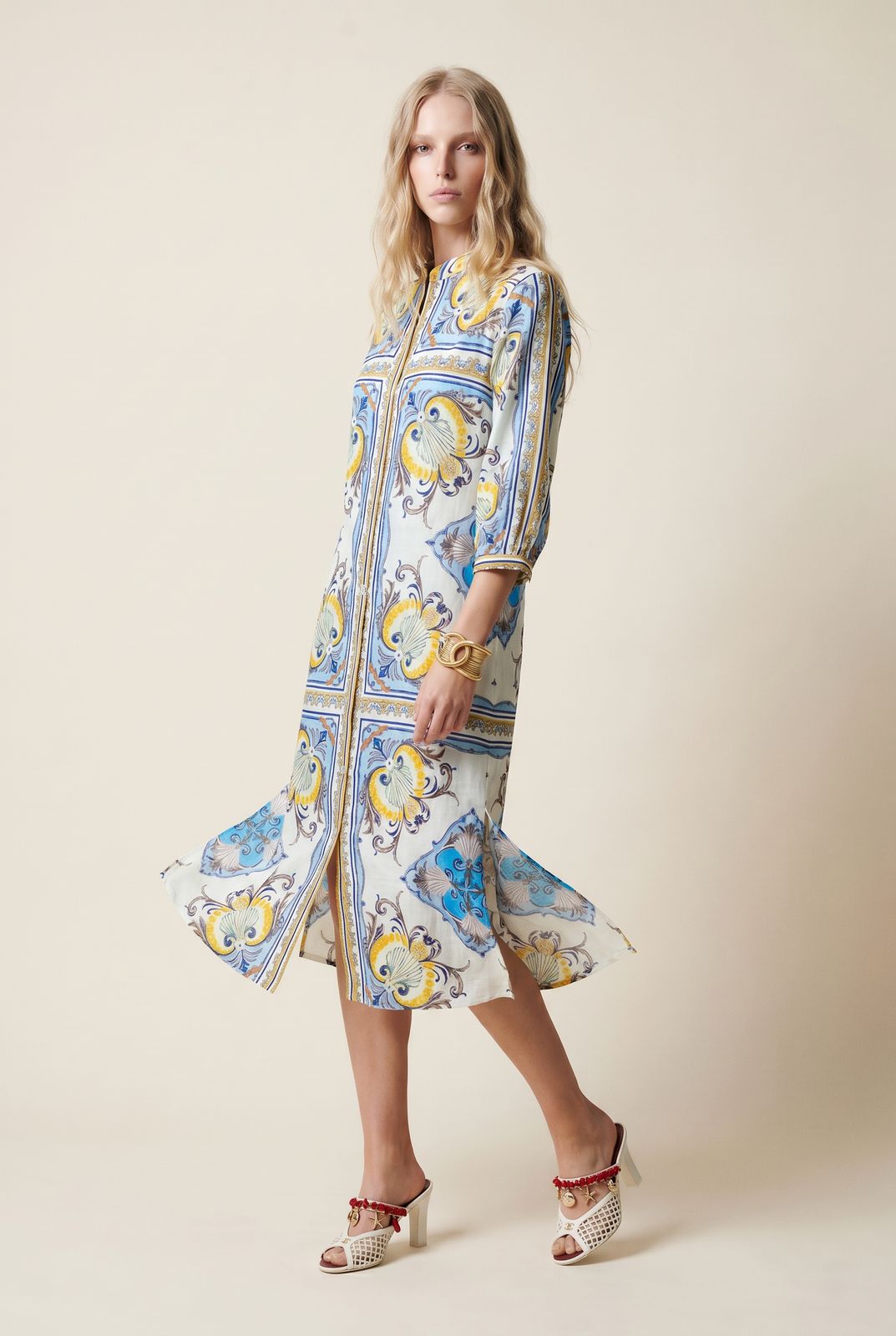 a woman in a blue and yellow dress