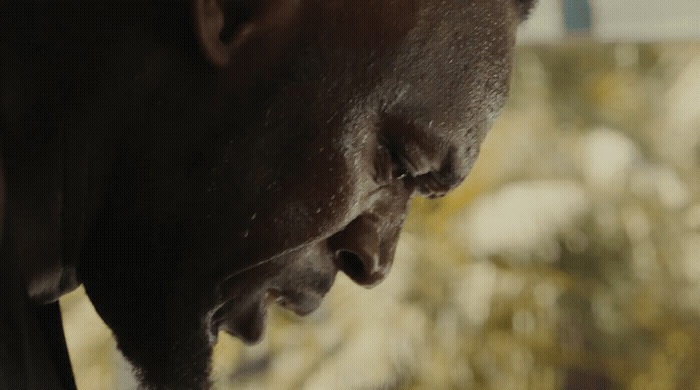 a close up of a man with his nose open