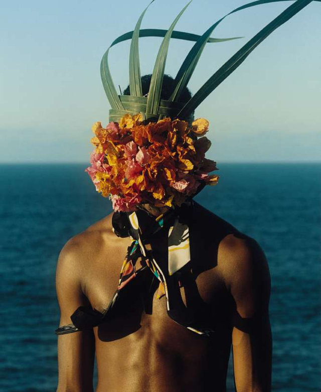 a man with a flower crown on his head