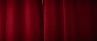 a close up of a red curtain in a room