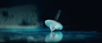 a blurry photo of a white object on a table