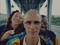 a group of people riding on a bus together