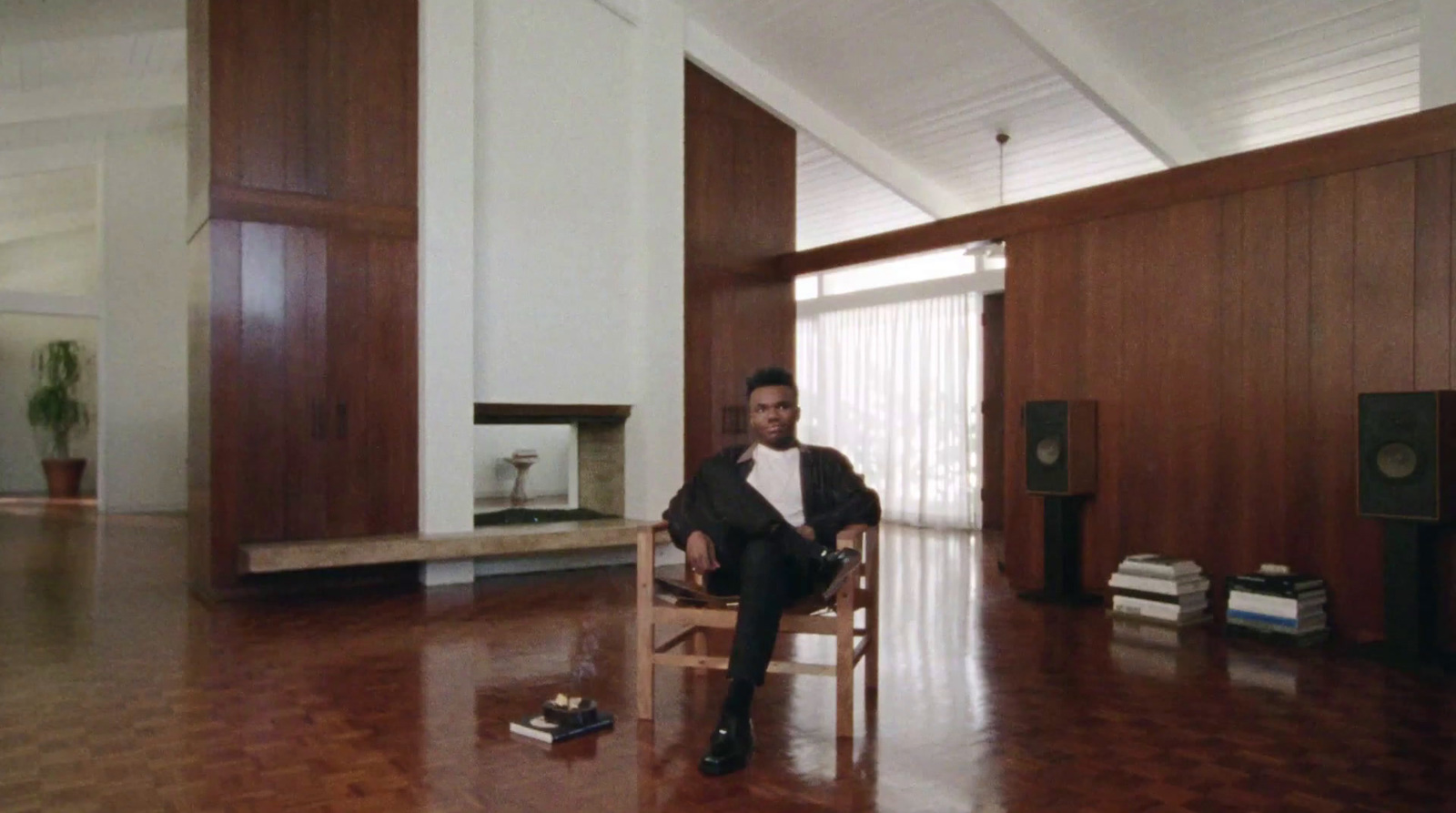 a man sitting in a chair in a room