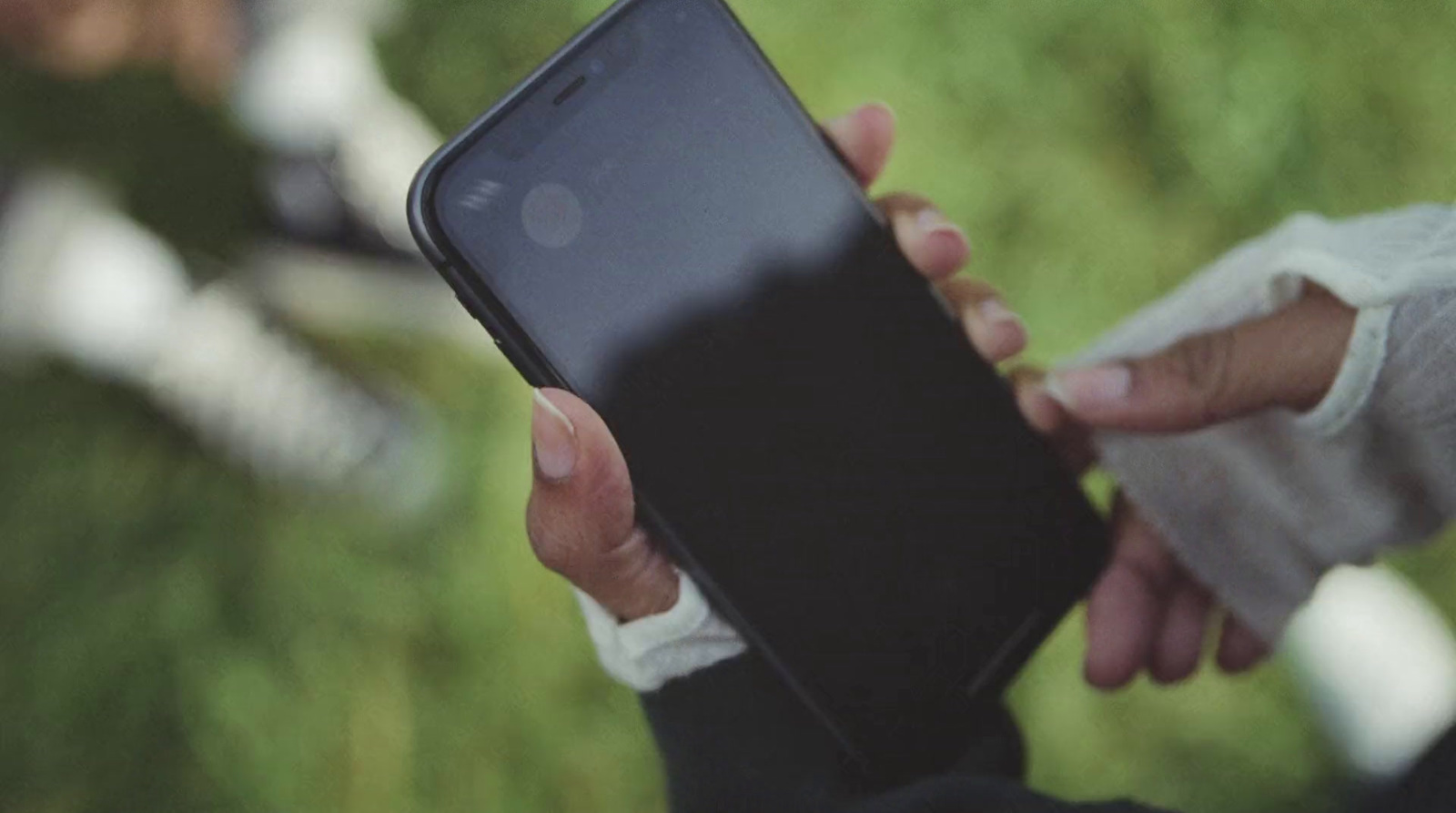 a person holding a smartphone in their hands