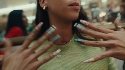 a close up of a person putting on makeup