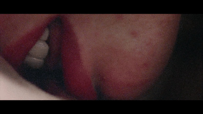 a close up of a person's lips with a toothbrush in their mouth