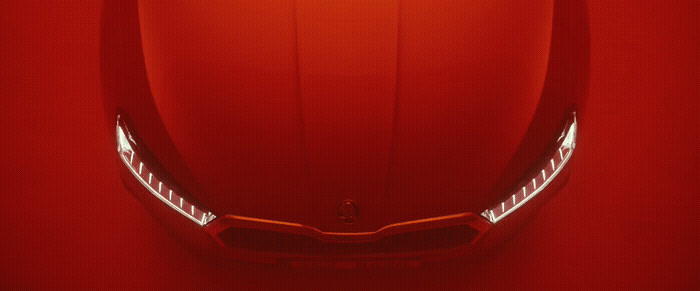 a close up of the front of a red sports car