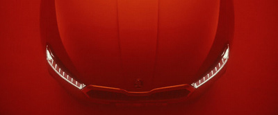 a close up of the front of a red sports car