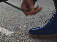 a close up of a person wearing blue shoes