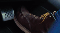 a close up of a pair of shoes in a car