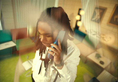 a woman holding a cell phone to her ear