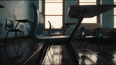 a row of chairs sitting next to each other on a wooden floor