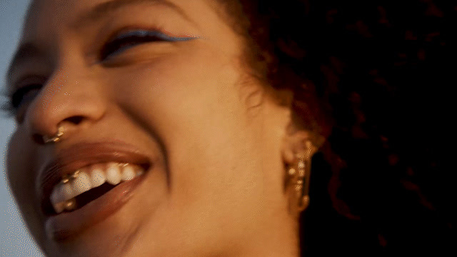 a close up of a woman with a smile on her face