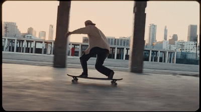 a skateboarder is riding a skateboard in a city