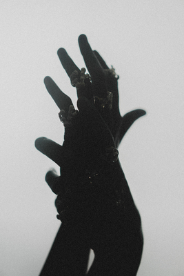 a black and white photo of a person's hand