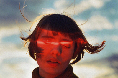 a woman with her hair blowing in the wind