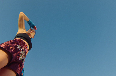 a man flying a kite high in the sky