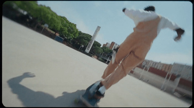 a man riding a skateboard down the side of a ramp