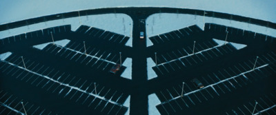 an aerial view of a bridge with cars driving on it