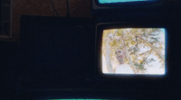 an old television with a picture of a man on it