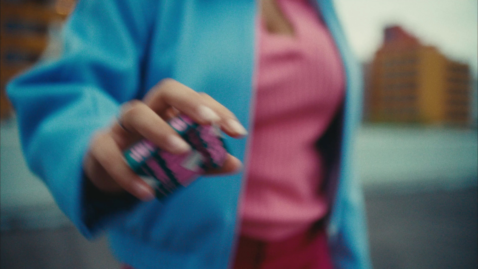 a woman holding a cell phone in her hand