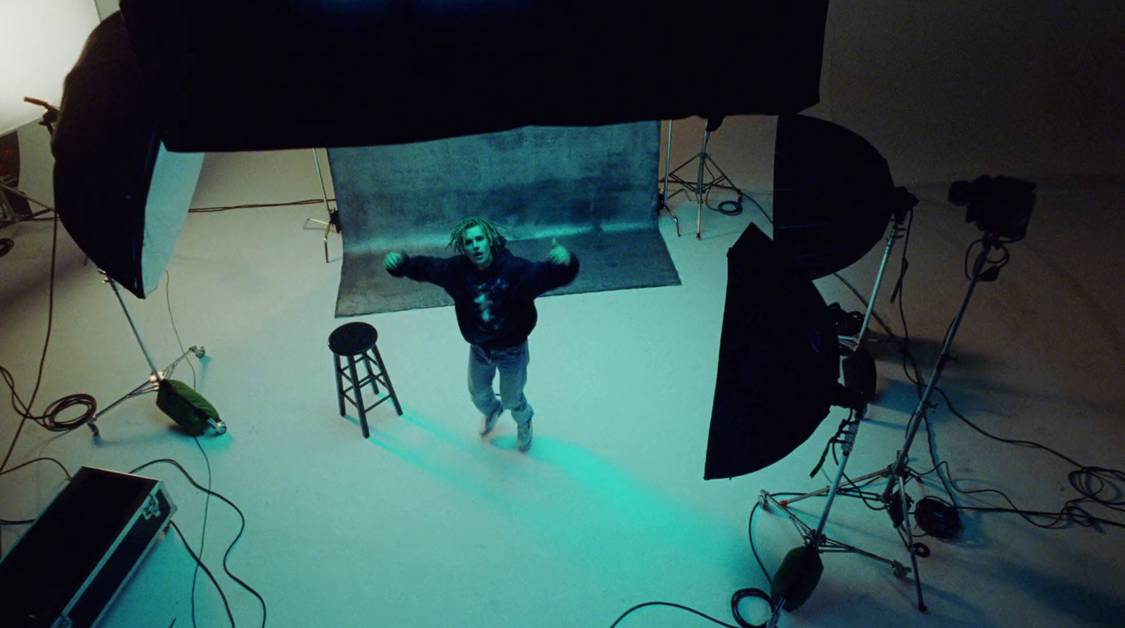 a man standing in front of a camera in a room