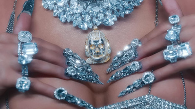 a close up of a person wearing silver jewelry