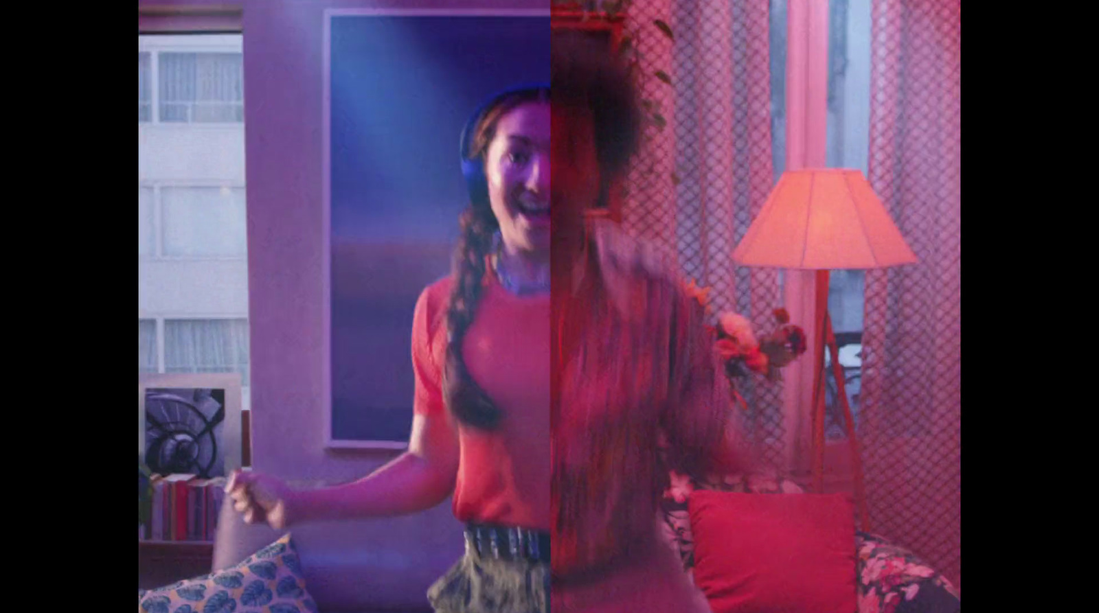 a woman in a red top is dancing in a room