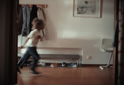 a young child is running in a room