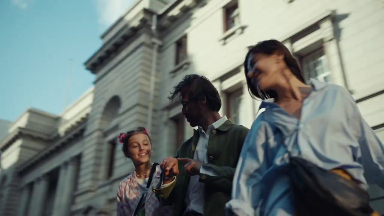 a group of people walking down a street