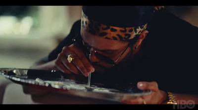 a woman wearing a leopard print headband and holding a plate