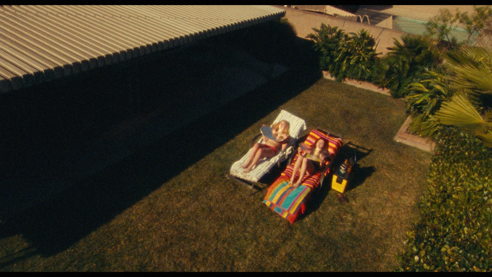 a couple of people laying on top of a blanket