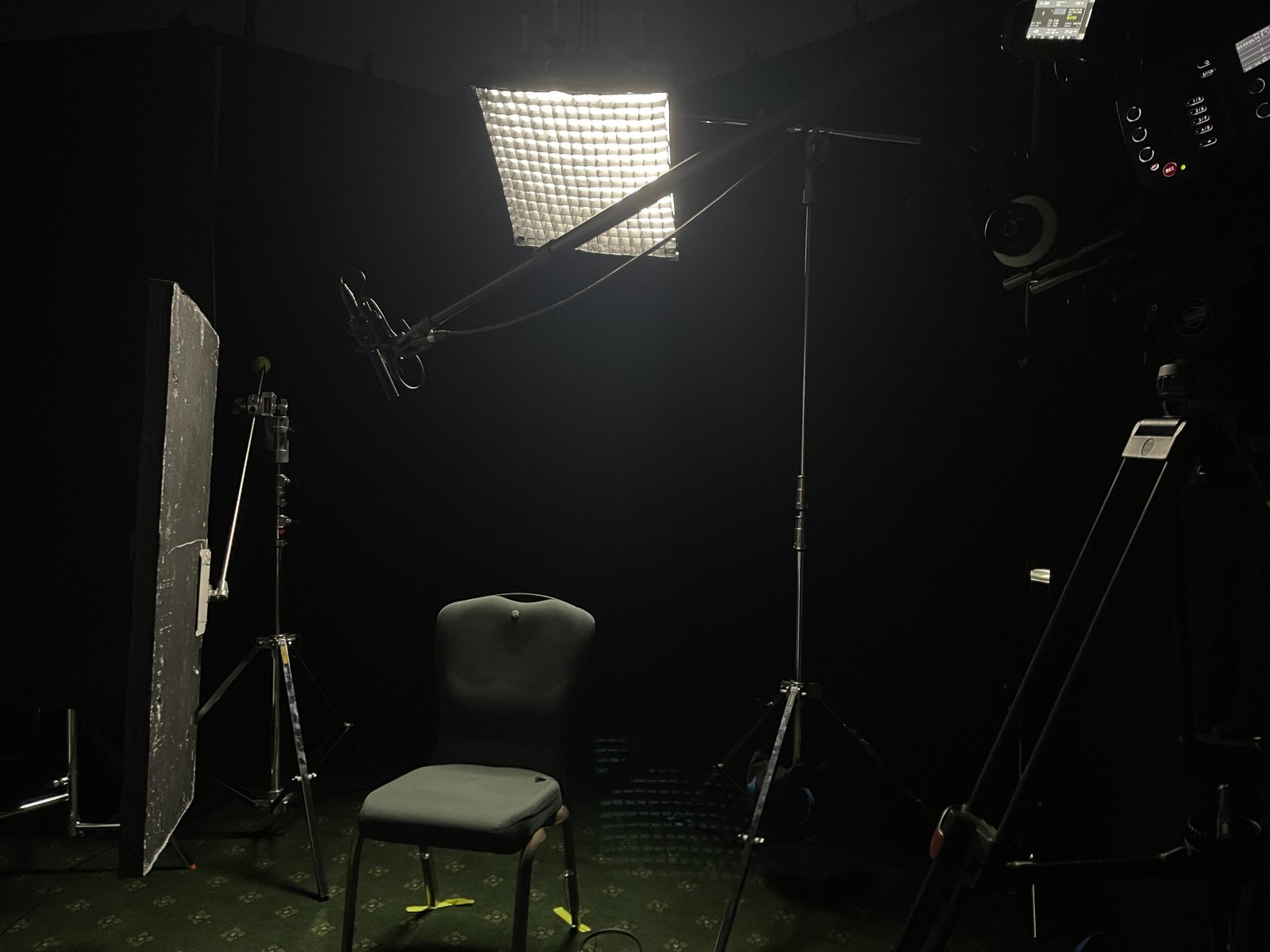 a chair in a dark room with lights