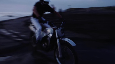 a man riding on the back of a motorcycle