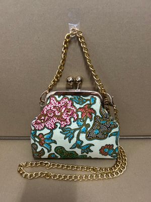 a purse with a chain attached to it