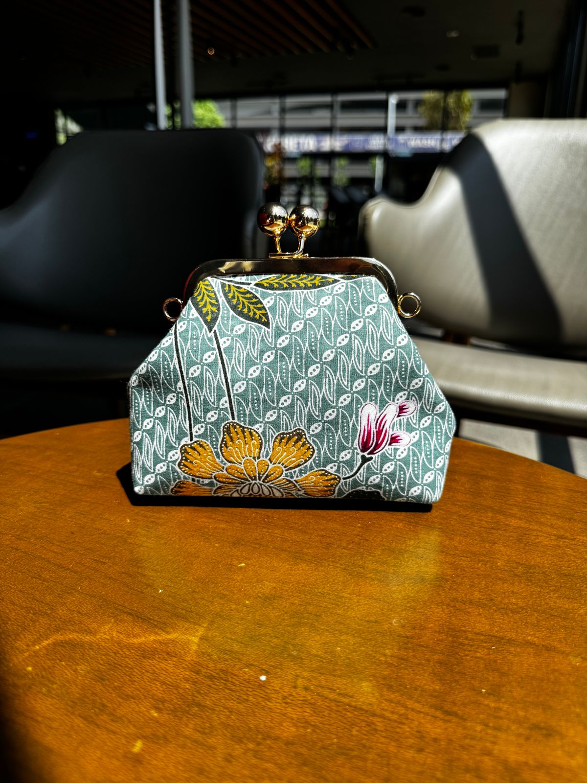 a purse sitting on top of a wooden table