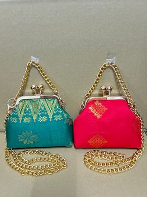a pair of purses sitting on top of a table