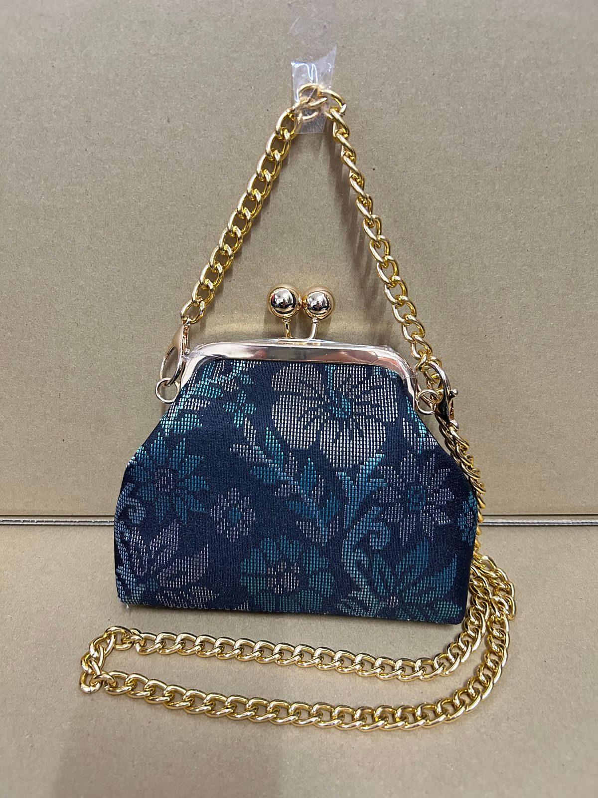 a blue purse sitting on top of a table