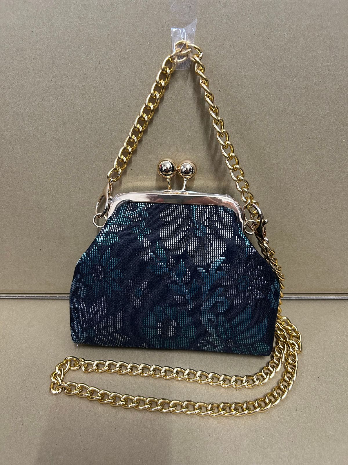 a blue purse sitting on top of a table