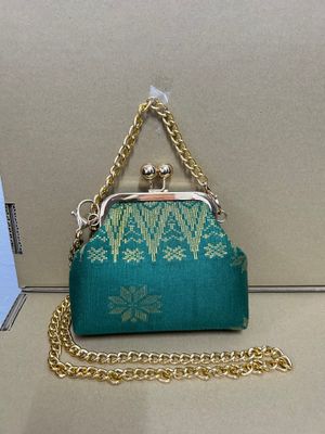 a purse with a chain attached to it