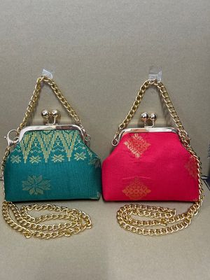 a pair of purses sitting on top of a table
