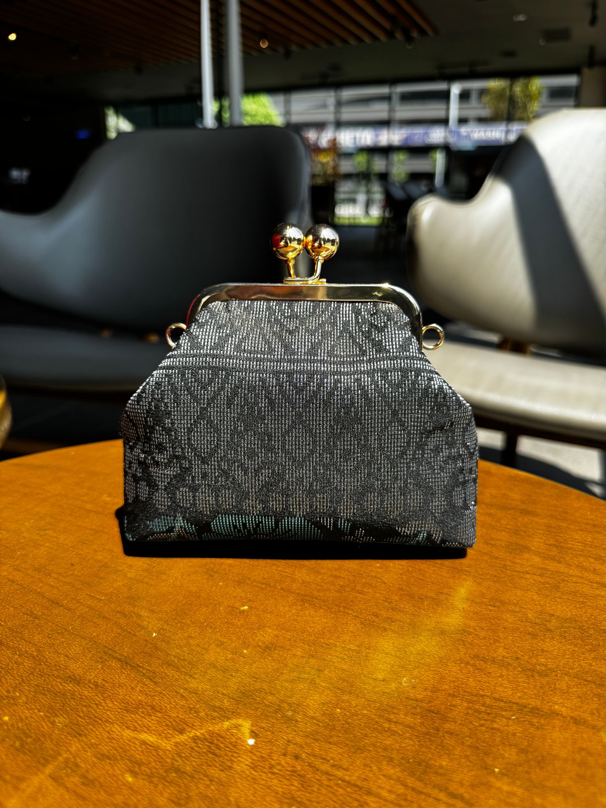 a purse sitting on top of a wooden table