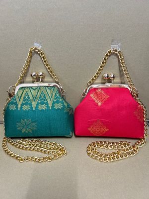 a pair of purses sitting on top of a table