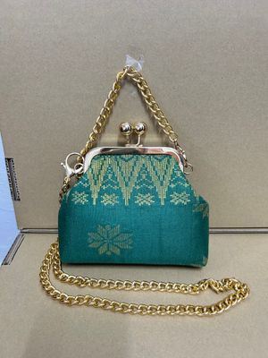 a purse with a chain attached to it