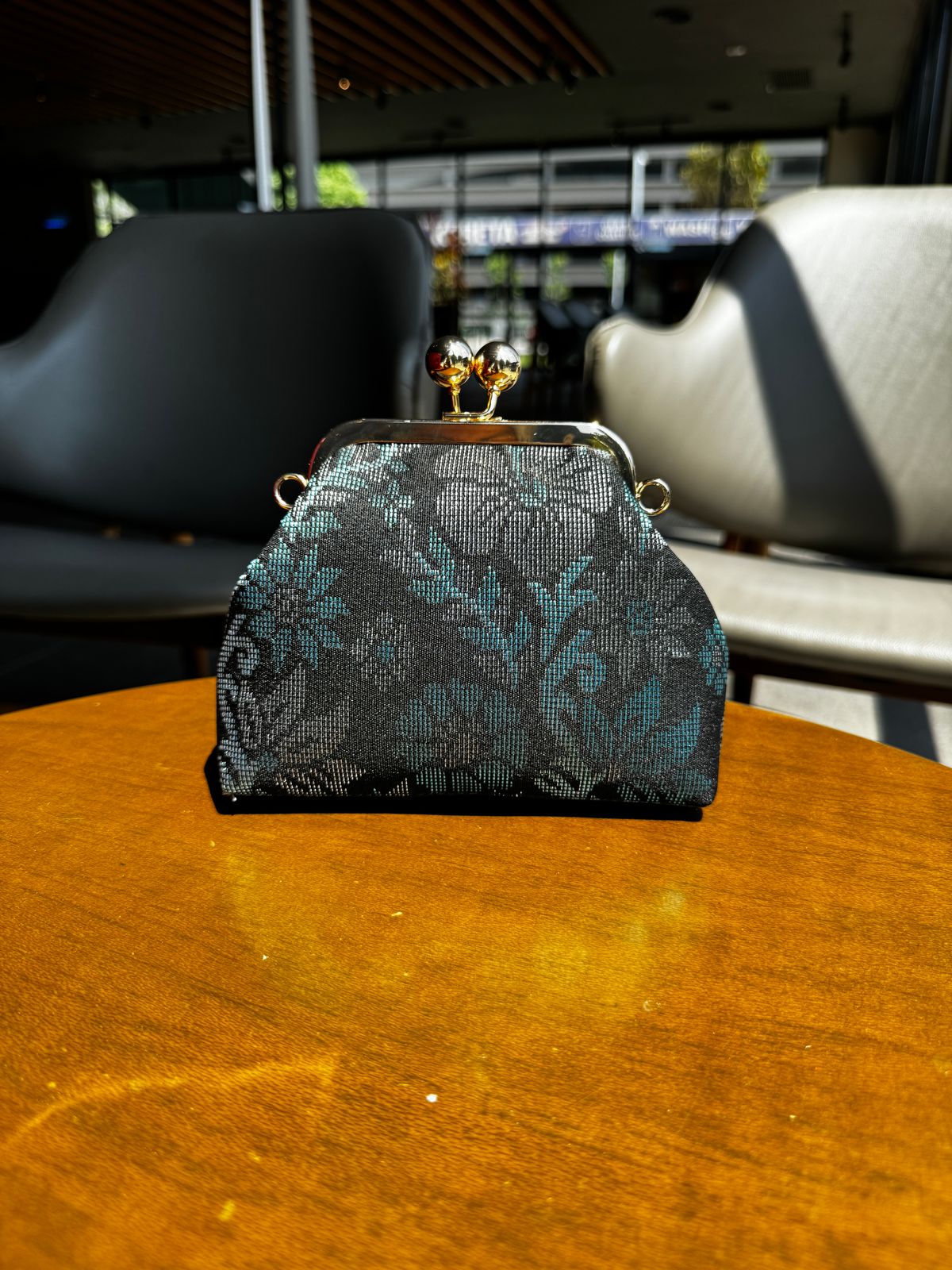 a purse sitting on top of a wooden table