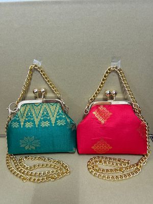 a pair of purses sitting on top of a table
